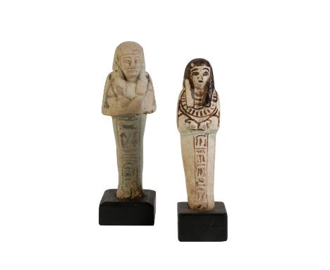 ANCIENT EGYPTIAN FAIENCE USHABTI FIGURE with painted detail and hieroglyphic panel and another, 13cm max. Provenance: The Pet