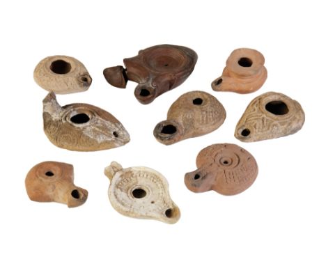 ROMAN RED-WARE DOUBLE-SPOUT OIL LAMP and eight other ancient pottery oil lamps (9). Provenance: The Peter Newall Collection