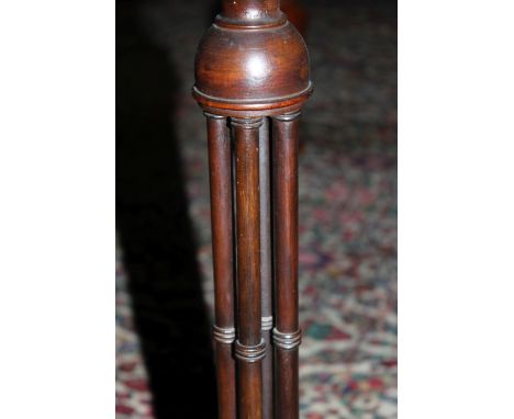 A George III style mahogany tripod table on four column support 61cm high, 38cm diameter 