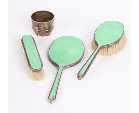 Silver: A small silver bowl with garland decoration and a three piece green enamelled hair brush set.