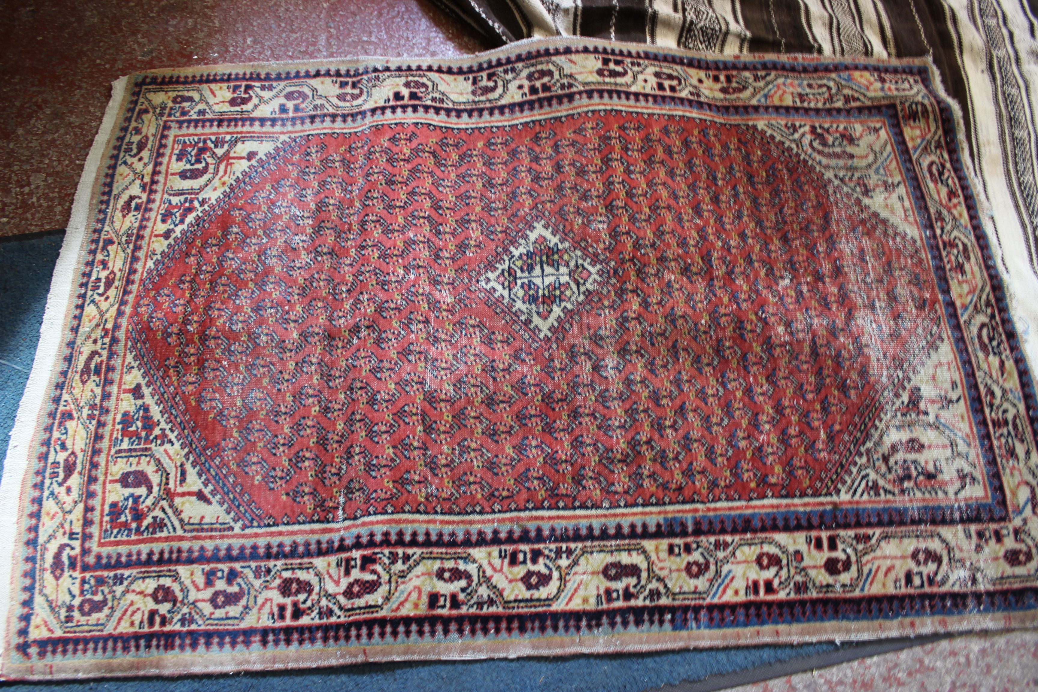 A North African Berber rug 133 x 280cm and a Middle Eastern carpet