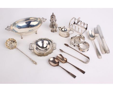 Silver: A quantity of silver table ware including a Walker Hall oval bowl, toast rack, tea strainer, salts, peppers, sugar to