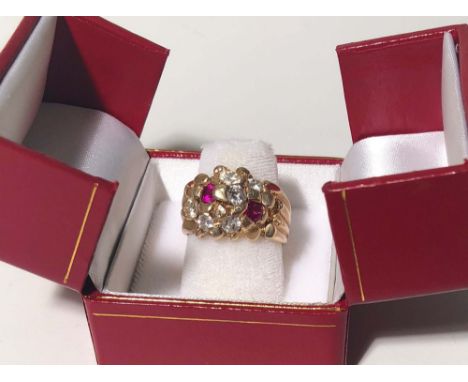ELVIS PRESLEY PERSONALLY OWNED AND WORN DIAMOND AND RUBY 14K GOLD RING. The 14k gold "nugget" style ring is set with 6 diamon