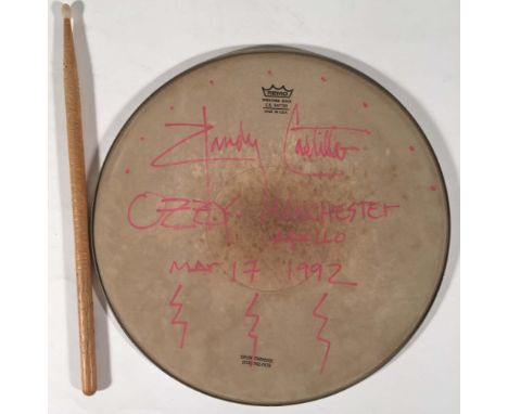 RANDY CASTILLO SIGNED DRUM SKIN AND STICK. A Remo drum skin inscribed and signed in pink ink in the hand of Randy Castillo, d