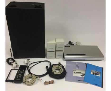 BOSE ACOUSTIMASS AND LIFESTYLE MUSIC SYSTEM. A Bose Acoustimass Powered Speaker System, a Bose Lifestyle Music Center, manual