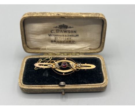 Ladies Antique 9ct yellow gold Seed Pearl and Ruby brooch with chain weighing 2.65 grams gross in box 