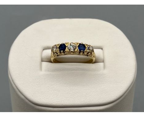 Ladies stunning 18ct gold diamond and sapphire 5 stone ring, size M1/2 (4.09g)