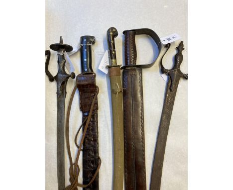 * Indian Swords. 19th century Indian tulwar, the 78 cm curved blade with iron steel hilt and shaped kuckleguard, overall leng