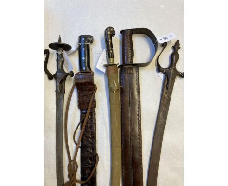 * Indian Swords. 19th century Indian tulwar, the 78 cm curved blade with iron steel hilt and shaped kuckleguard, overall leng