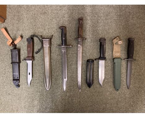* Bayonets. A Garrand bayonet, the 25 cm blade stamped US with flaming grenade and PAL, composite grip, overall length 36 cm,
