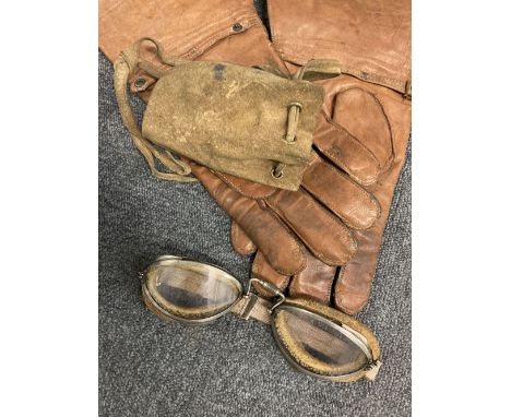 * Flying Apparel. 1930s pilot's flying equipment, comprising a WWI period brown leather coat (very poor condition), a cotton 