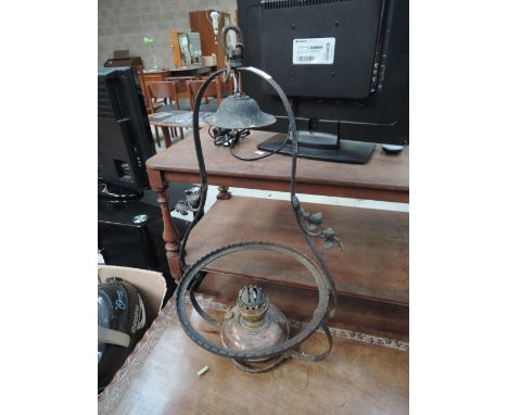 A copper and brass oil lamp with cast ceiling fitting 