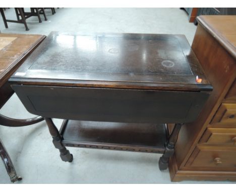 An Ercol or Priory style dark stained tea trolley