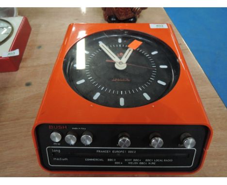 A vintage Bush radio/wall clock with Rank Organisation branding 