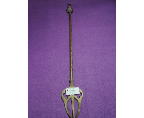 A brass cast toasting fork with William Wordsworth figure head
