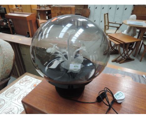 A fibre optic lamp of naturalistic floral form with globe shade 