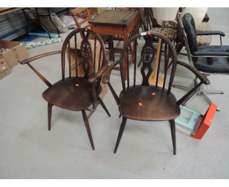 A pair of traditional Ercol carver chairs