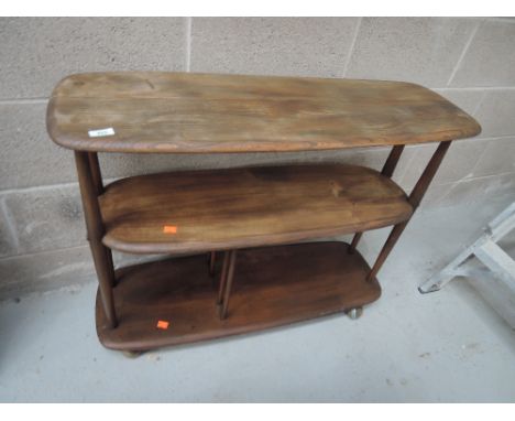 A dark Ercol bookshelf/trolleyFAIR CONDITION, SPLIT DEVELOPING TO TOP