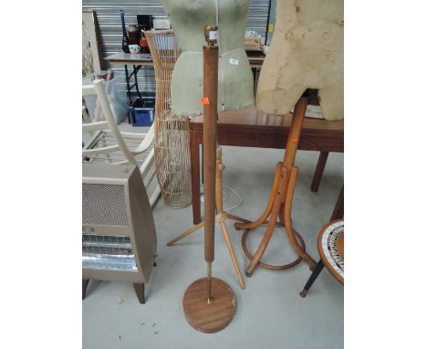 A vintage teak standard lamp