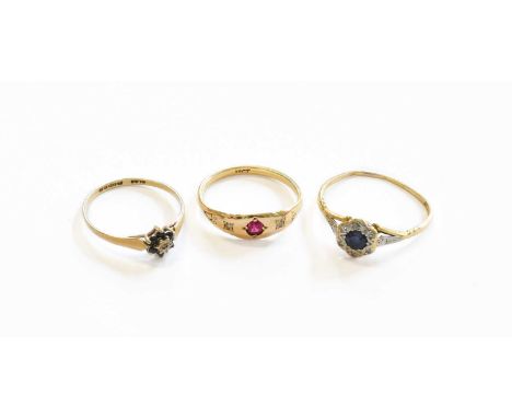 A 9 Carat Gold Sapphire and Diamond Cluster Ring, finger size N1/2; A Synthetic Ruby and Diamond Three Stone Ring, stamped '1