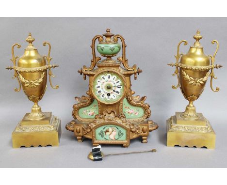 A Gilt Metal and Porcelain Mantel Timepiece, with associated gilt metal urn shaped garnitures, clock 32cm high (3)