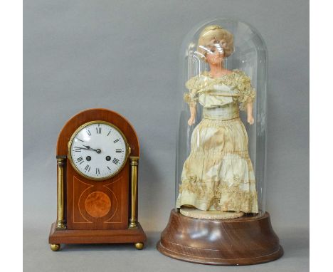An Edwardian Mahogany Striking Mantel Clock; Wax Doll under dome and a gilt metal equestrian plaque