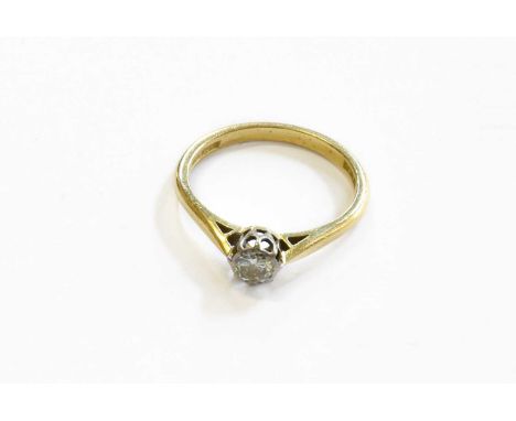 A Diamond Solitaire Ring, the round brilliant cut diamond in a white rubbed over setting, to a yellow tapered shoulder plain 