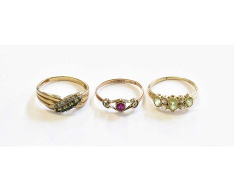 A Peridot and Diamond Ring, unmarked, finger size M; A 9 Carat Gold Emerald and Diamond Crossover Ring, finger size O1/2; and