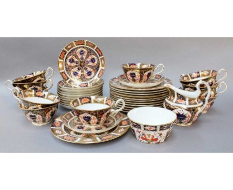 A Royal Crown Derby Imari Twelve Place Tea Service, comprising twelve trios, a cream jug and sugar bowl, pattern 1128, date c