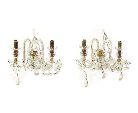 A Pair of Cut Glass Twin-Light Wall Sconces, in Georgian style, with urn shaped sockets and scroll branches34cm wide