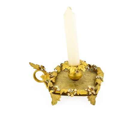 A Gilt Metal and Enamel Chamberstick, 19th century, on a square base,12.5cm longSconce and handle slightly loose. Sits square