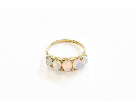 An 18 Carat Gold Opal Five Stone Ring, the graduated opals with rose cut diamond accents, in yellow claw settings, with a scr