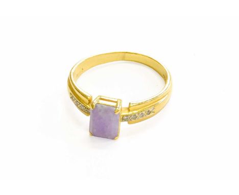 A Jade and Diamond Ring, the step cut jade in a yellow four claw setting, to eight-cut diamond set shoulders, on a plain poli