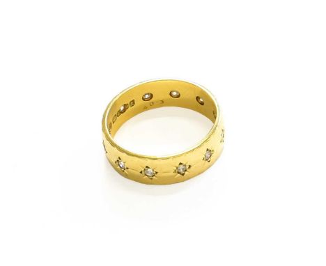 An 18 Carat Gold Diamond Ring, the round brilliant cut diamonds in yellow star settings, total estimated diamond weight 0.15 