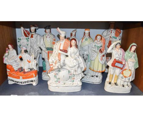 A Collection of Large Victorian Staffordshire Pottery Musical Figures, including a pair of figures on a table base, organ gri