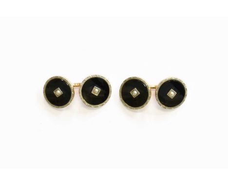 A Pair of Onyx and Split Pearl Cufflinks, formed of chain linked circular onyx plaques with a split pearl centrallyStamped '1