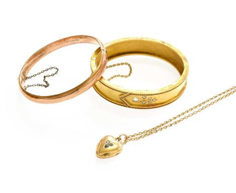 A 9 Carat Gold Hinged Bangle, inner measurements 6.0cm by 5.4cm; A Locket on Chain, pendant length 2.5cm, chain length 51cm; 