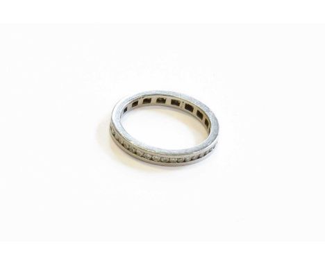 A Platinum Diamond Eternity Ring, the round brilliant cut diamonds in a channel setting, total estimated diamond weight 0.55 