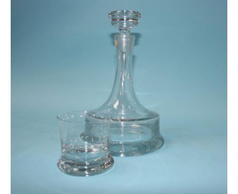A clear glass decanter and six tumblers