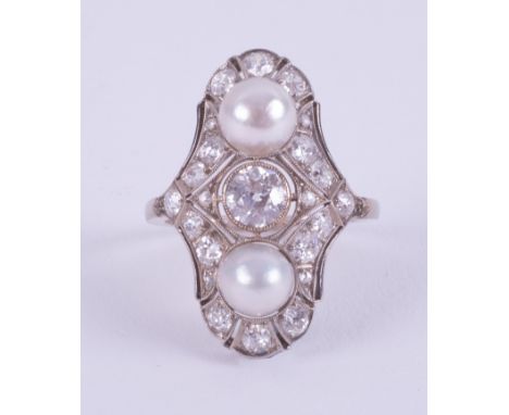 An Art Deco 1930's white gold (not tested or hallmarked) ring set with two 6.5mm white pearls, a central old round cut diamon