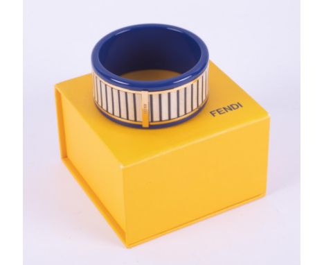 A Fendi blue acrylic bangle with wood effect striped pattern all the way around and gold tone detailing and Fendi logo, comes