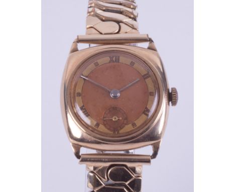 A 9ct yellow gold vintage manual wind gent's wristwatch with a cushion shaped face on a stainless steel & rolled gold fronted