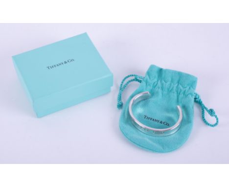 A silver Tiffany &amp; Co concave design cuff bangle, stamped inside 1997 Tiffany &amp; Co 925 and on the front, 925 T &amp; 