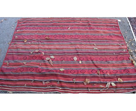 A Kelim style rug having lined decoration, 180 x 140cm.