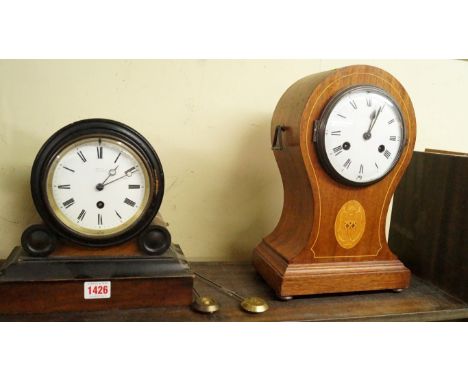 A mahogany and inlaid balloon mantel clock, 33cm high; together with another late Victorian walnut and ebonized mantel timepi