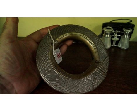 Ethnographica: an African metal slave bangle, with repeat decoration.