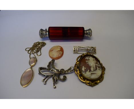 A 9ct yellow gold oval pendant set mother of pearl on a 9ct yellow gold box chain; together with one mounted and one unmounte