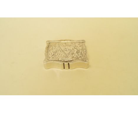 An Edwardian silver snuff box, by William Thorneywork, Birmingham 1902, of shaped outline and having chased lid, 6 x 4.5cm, 5