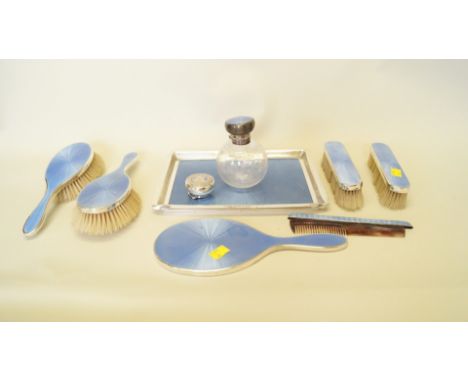 A silver and blue guilloche enamel dressing table set, by Charles Henry Dumenil, London 1920-1922, comprising; a rectangular 