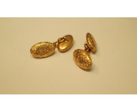 A pair of 15ct gold engraved oval cufflinks, 5.7g.